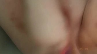 Babe with long nails uses pink toy to play
