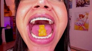 Lila Jordan swallow a yellow gummy bear, vore bizarre