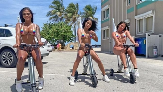 Monstrous Booty Latinas Ride Electric Trikes At Public Beach Giant Behind