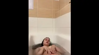 Skinny brunette in bath